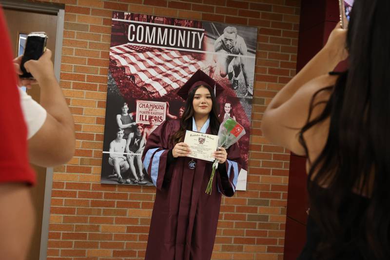 Kankakee High School Laisha Gomez poses for photos with her diploma following the summer commencement ceremony at the high school on Tuesday, July 29, 2025.