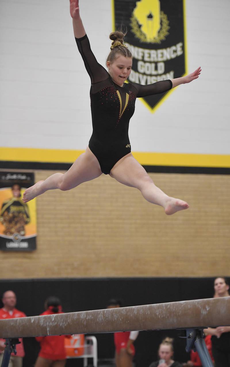 Batavia's Leah Flesch on the balance beam at the Hinsdale South girls gymnastics sectional meet in Darien on Tuesday, February 7, 2023.