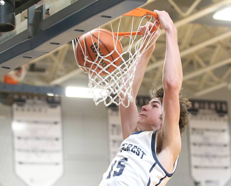 Fieldcrest's Brady Ruestman dunks the ball against Woodland on Tuesday, Dec. 19, 2023 at Fieldcrest High School.