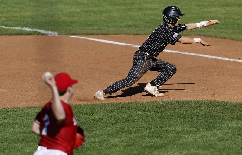 Deerfield's Mac Jones throws to first base as he tries to get Prairie Ridge's Brennan Coyle out during a Class 3A Deerfield baseball regional game on Wednesday, May 22, 2024, at the Deerfield High School.