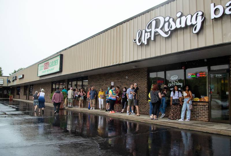 Attendees of the UpRising Bakery and Cafe's drag bunch wait to enter the bakery on Sunday, Aug. 7, 2022.