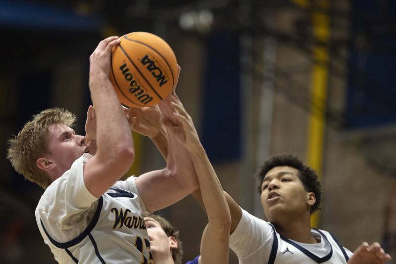 Sterling’s Will Ports pulls in a rebound against Sherrard Monday, Dec. 16, 2024, at Sterling High School.