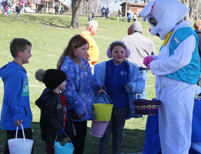 Kids visit with the Easter bunny during the Easter Egg Hunt on Saturday, March 28, 2026 at Centennial Park in Peru.