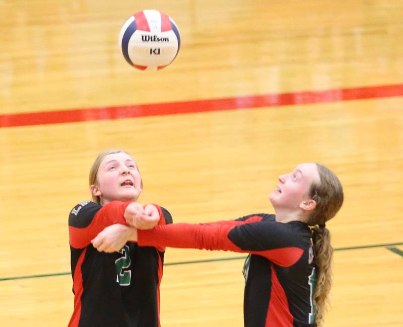 L-P's Bridget Hoskins and Katie Sowers return a serve while hitting the ball at the same time on Tuesday, Aug. 22, 2023 in Sellett Gymnasium.