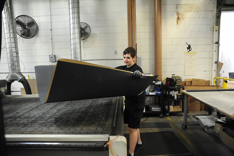 Tim Kasper, a rising Cary-Grove High School senior, moves material Friday, June 10, 2022, as he works as an intern at Jessup Manufacturing in McHenry. The Manufacturing Pathways Consortium in McHenry County launched a new paid internship this summer that is looking to train current and recent high school students in various manufacturing skills in effort to help expand the pipeline of quality manufacturing workers in the county.