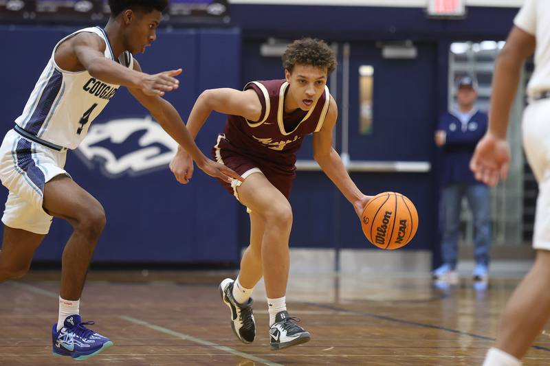 Morris’ Baylen Lee takes the ball upcourt against Plainfield South on Wednesday, Jan. 28, 2026 in Plainfield.