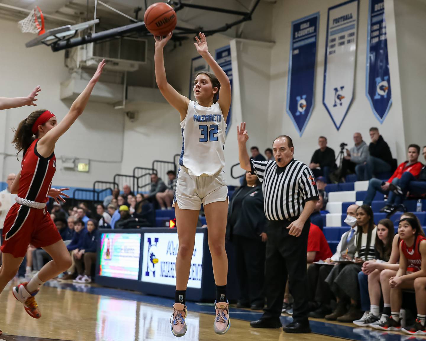 Nazareth's Stella Sakalas (32) shoots a jump shot during varsity basketball game between Deerfield at Nazareth.  Jan 23, 2023.