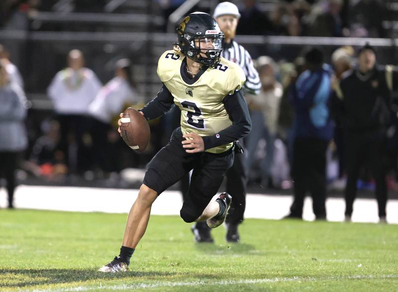 Sycamore's Elijah Meier looks for a receiver during their game against Woodstock North Friday Oct. 7, 2022, at Sycamore High School.