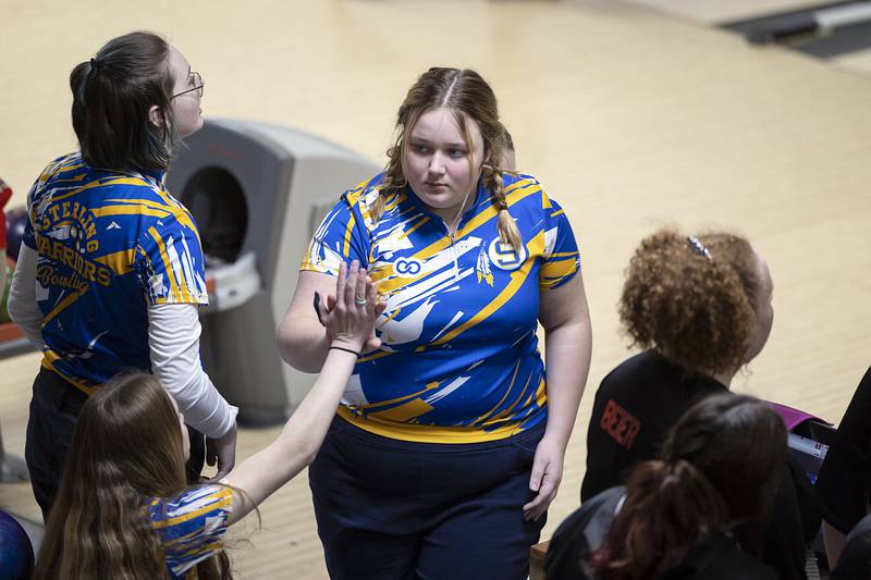Sterling’s Shayla Kelly celebrates with teammates during bowling regionals at Plum Hollow in Dixon on Saturday, Feb. 4, 2023.Saturday, Feb. 4, 2023.
