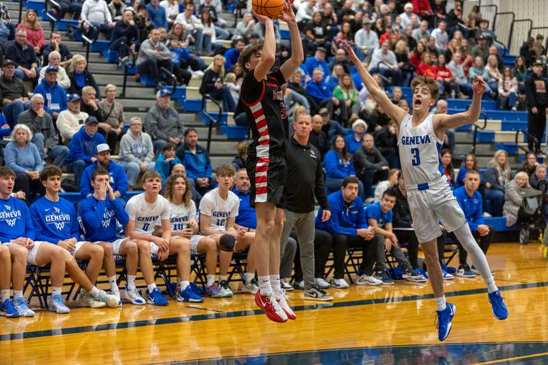 Batavia's Evan Blankenship shoots a three pointer over Geneva's Nathan Palmer on Friday, Dec.19,2025 in Geneva.