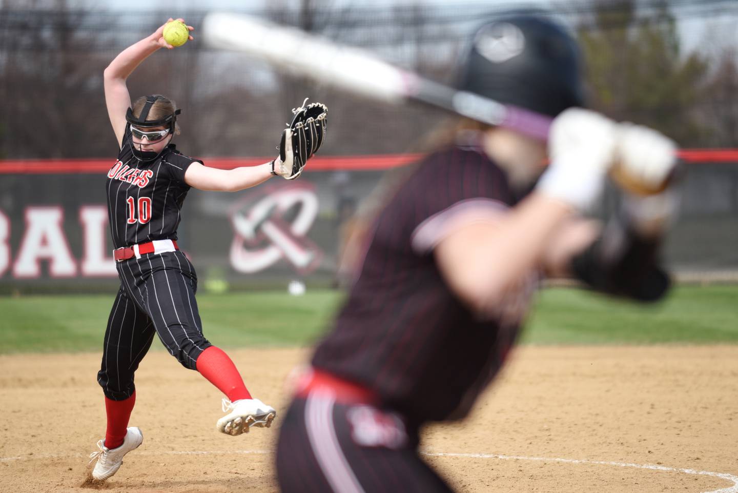 Bradley-Bourbonnais' Abi Hofbauer, left, throws a pitch to a Marist batter during a game at Bradley-Bourbonnais Saturday, March 21, 2026.