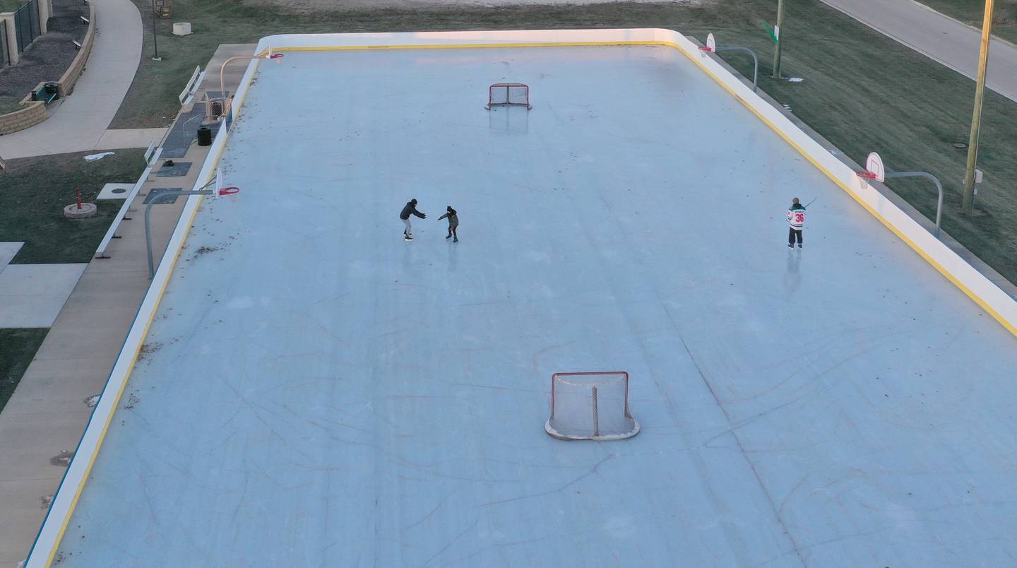 An aerial view of skaters skating on the ice on Thursday, Dec. 5, 2024 at Washington Park in Peru.