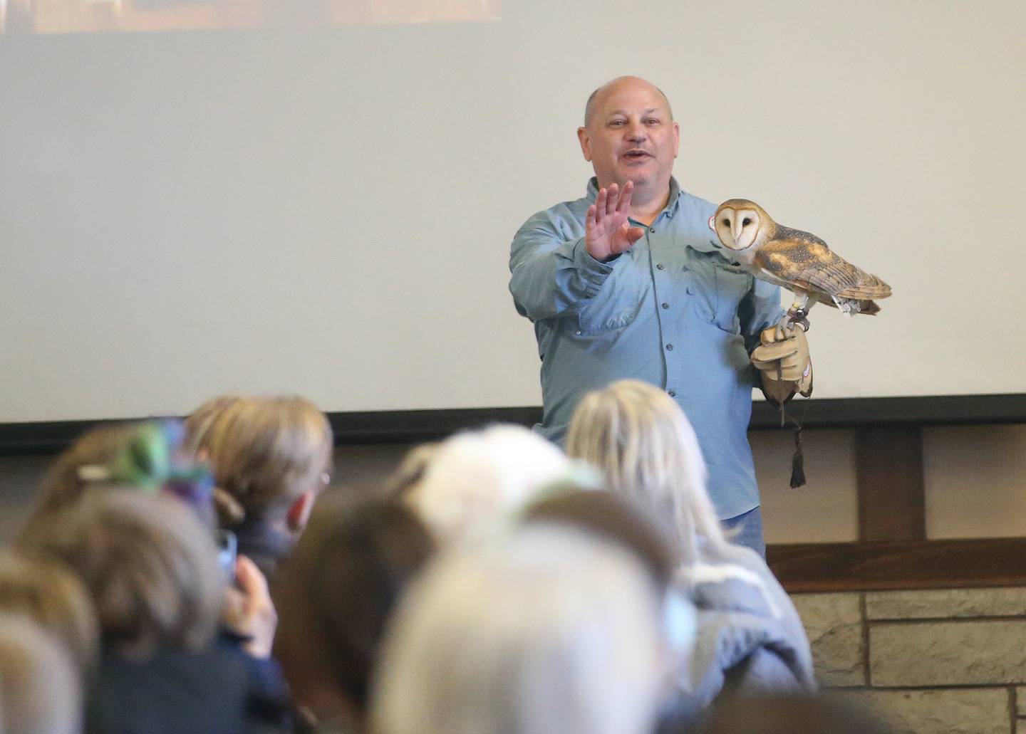 Jacques Nuzzo program director a the Illinois Raptor Center, shows a Barn owl during Eagle Watch Weekend on Saturday, Jan. 25, 2025 inside the Great Hall at Starved Rock Lodge.