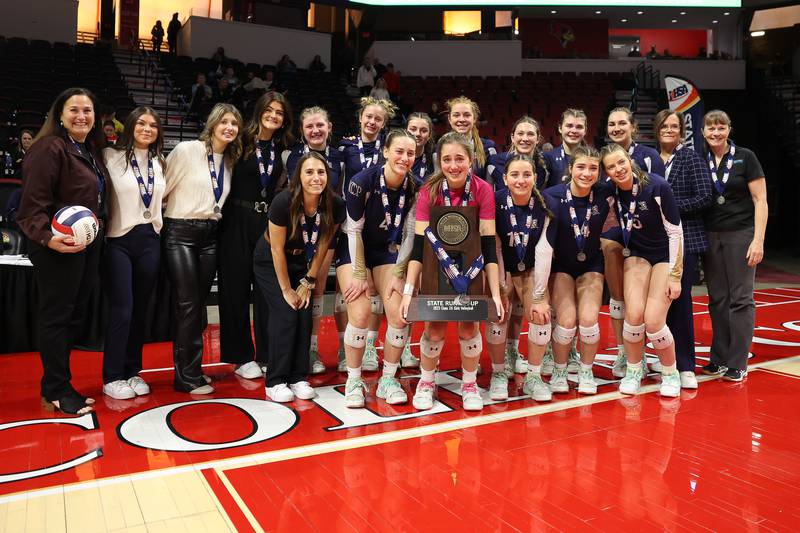 IC Catholic poses with the Class 2A State Runner-Up trophy against Mater Dei in the Class 2A Volleyball Championship match on Saturday, Nov. 11, 2023 in Normal.