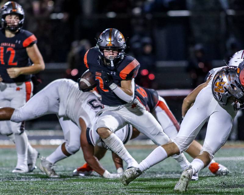 Minooka's Chase Nurczyk (21) takes off up the middle during football game between Plainfield North at Minooka.   Oct 6, 2023.