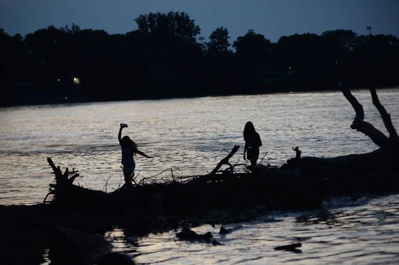 Two kids play at Prophetstown State Park as they wait for the fireworks to start  on Saturday, July 6, 2024.