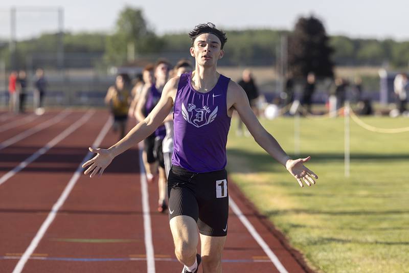 Dixon’s Dean Geiger celebrates his win in the 800 run Wednesday, May 20, 2026, at the Rochelle Class 2A boys track sectionals.