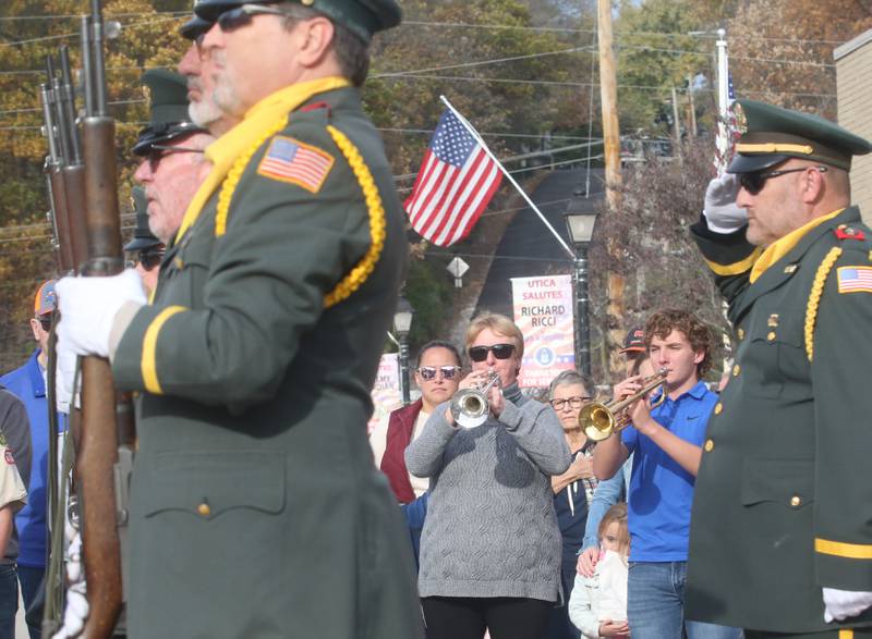 Nancy Stewart of Utica and her grandson Joey Patyk of Tonica,  play "taps" on trumpets during the 16th annual Utica Veterans Parade and Air Show on Sunday Nov. 5, 2023 downtown Utica.