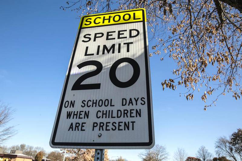 A sign warns drivers of the speed limit in a school zone Friday outside of Thomas Jefferson Elementary School in Joliet.
