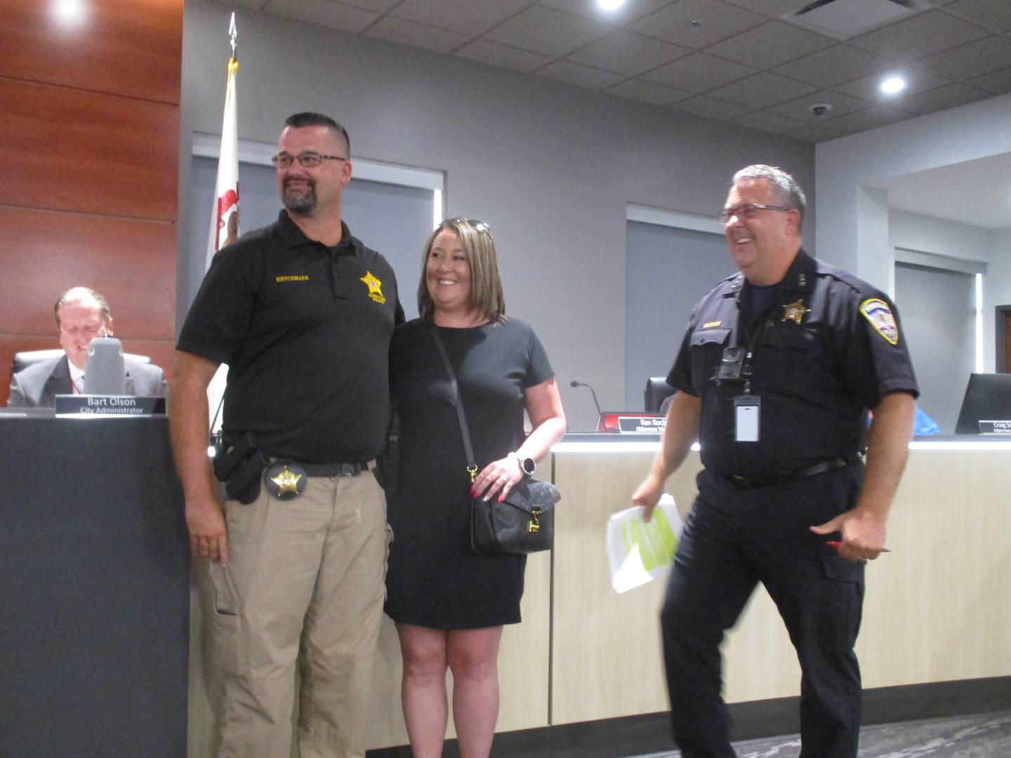 Yorkville police Detective Matt Ketchmark was honored by the Yorkville City Council for his recent award as Kendall County Investigator of the Year. He is seen here with his wife Megan and Yorkville police Chief Jim Jensen at right, Aug. 8, 2023.