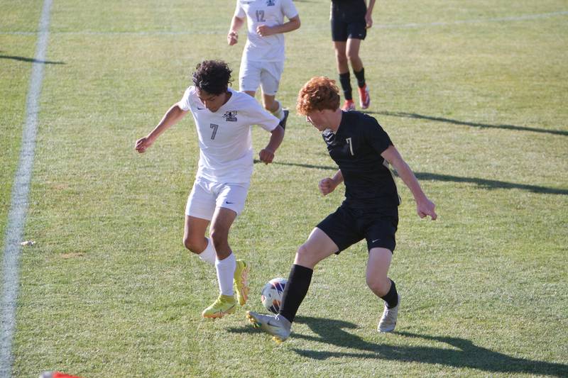 Kaneland's Miguel Andrade battles for the ball with Sycamore's Cameron Kruskol at the Class 2A Regional Final on Saturday, Oct. 22,2022 in Sycamore.