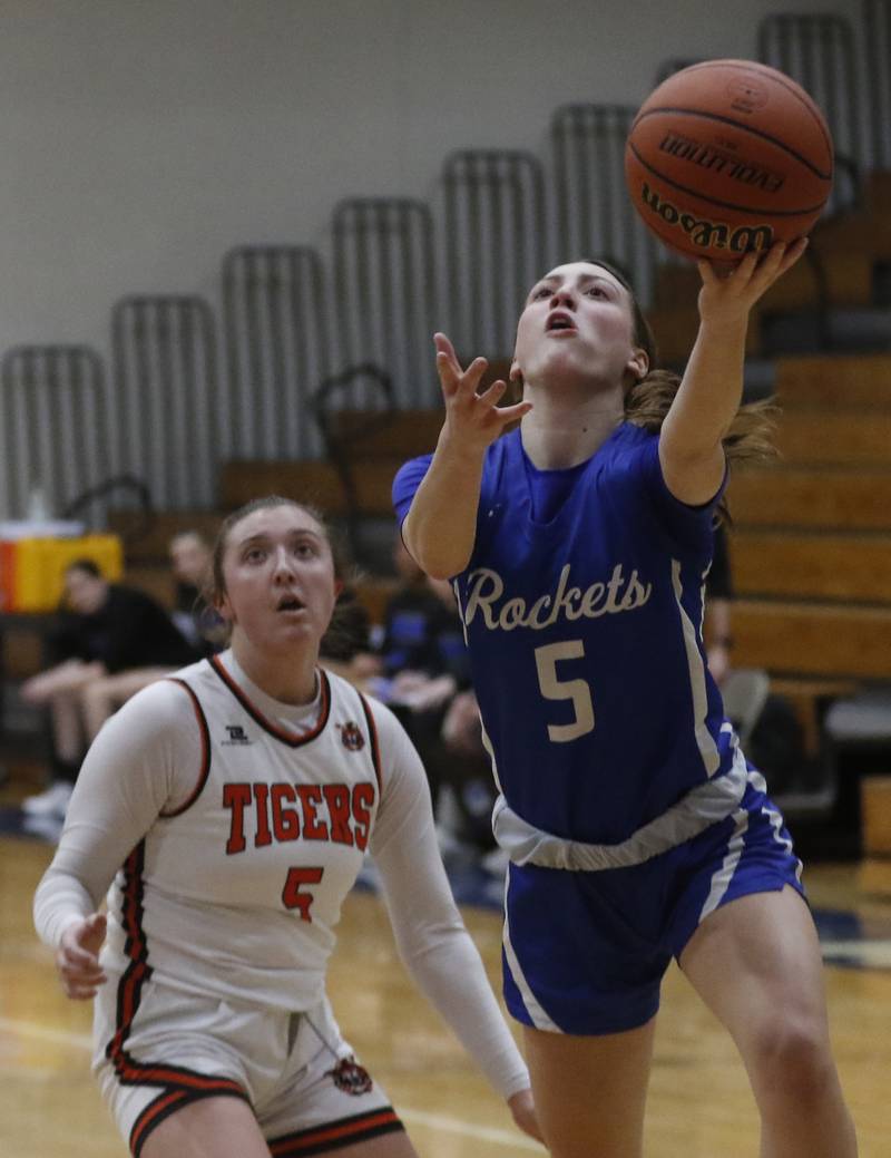 Burlington Central's Audrey LaFleur drives to the basket in front of Crystal Lake Central's Addison Cleary during the IHSA Class 3A Woodstock Regional Championship girls basketball game on Thursday, Feb. 15, 2024, at Woodstock High School.