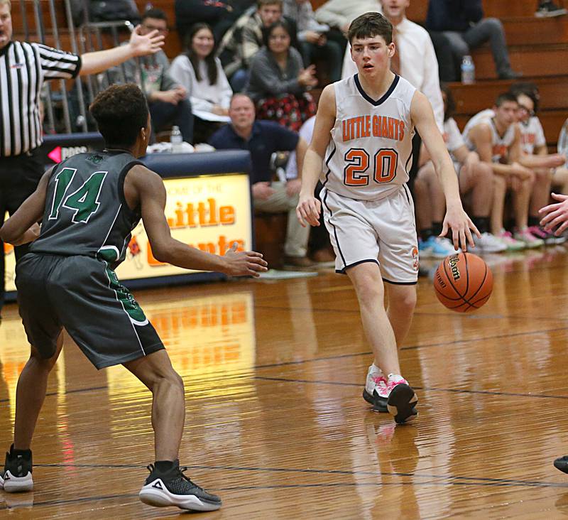 DePue's Vance Hayes (right) looks to pass the ball as Midland's Jeremiah Dyer (left) guards him on Monday, Dec. 19, 2022 at DePue High School.