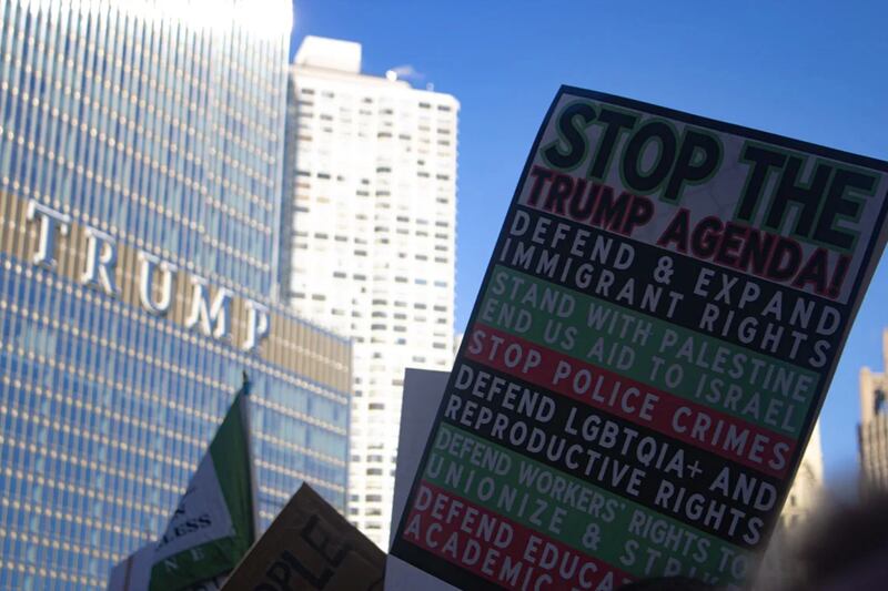 A protest sign outside of Trump Tower in Chicago on January 21, 2025