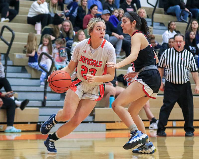 Plainfield East's Lexi Sepulveda (23) drives baseline during varsity basketball game between Yorkville at Plainfield East.  Jan 3, 2023.