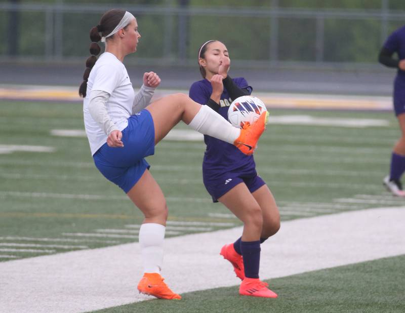 Princeton's Ava Kyle kicks the ball ahead of Mendota's Airam Cuevas during the Class 1A Regional final game on Tuesday, May 20, 2025 at Mendota High School.