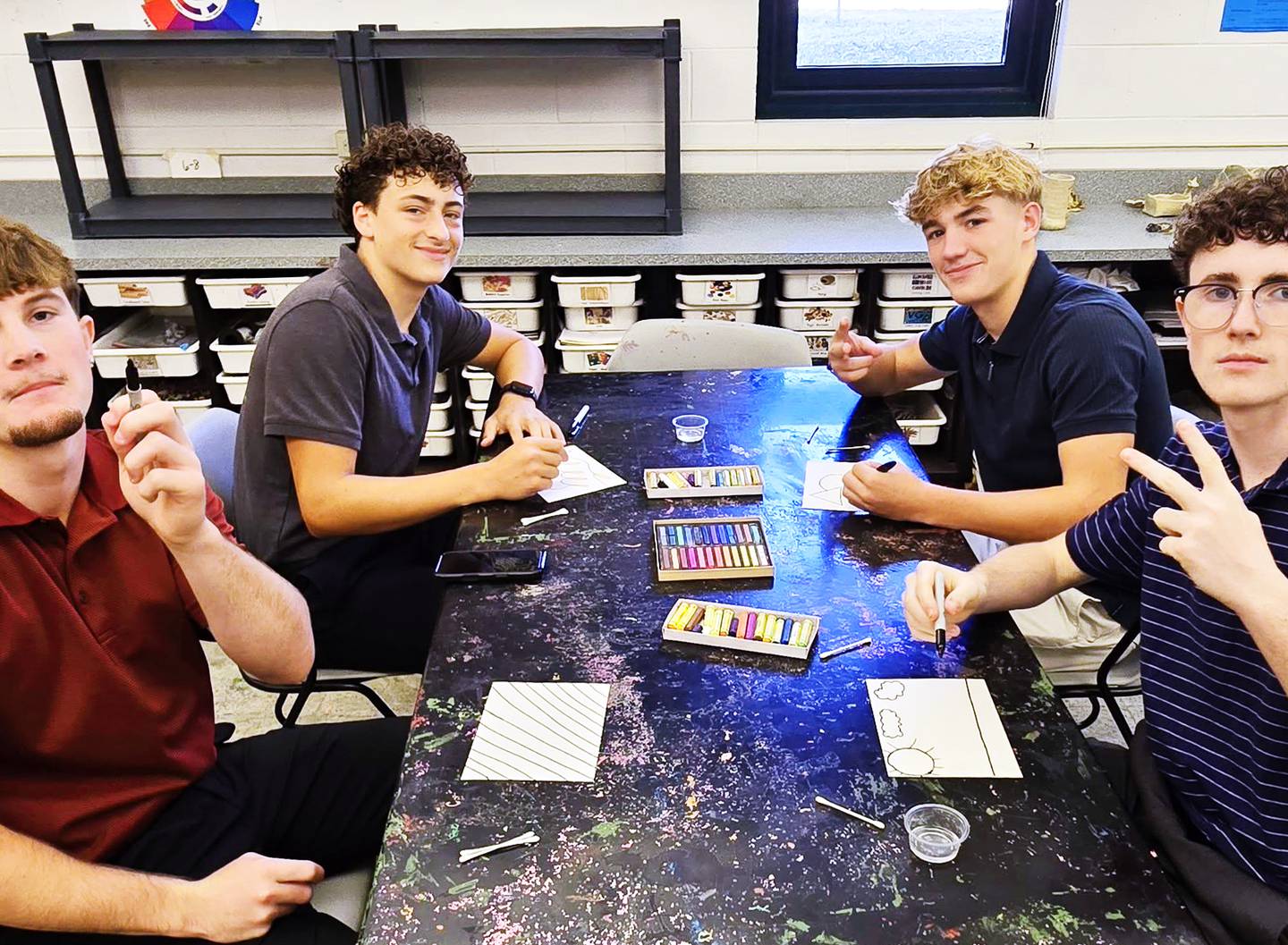 Whiteside Area Career Center CEO students (from left) Trail Stonitsch of Rock Falls, Brady Berlin of Sterling, Brecken Hayden of Lake Carroll and Wyatt Carroll of Lanark work on a career building activity Oct. 3 at Woodlawn Arts Academy in Sterling.
