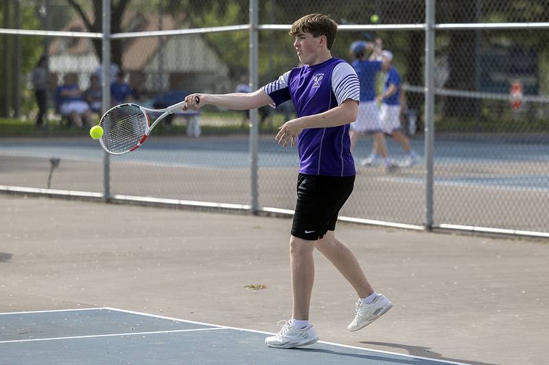 Dixon’s Owen Winters returns a shot against Newman while playing doubles Tuesday, May 9, 2023.