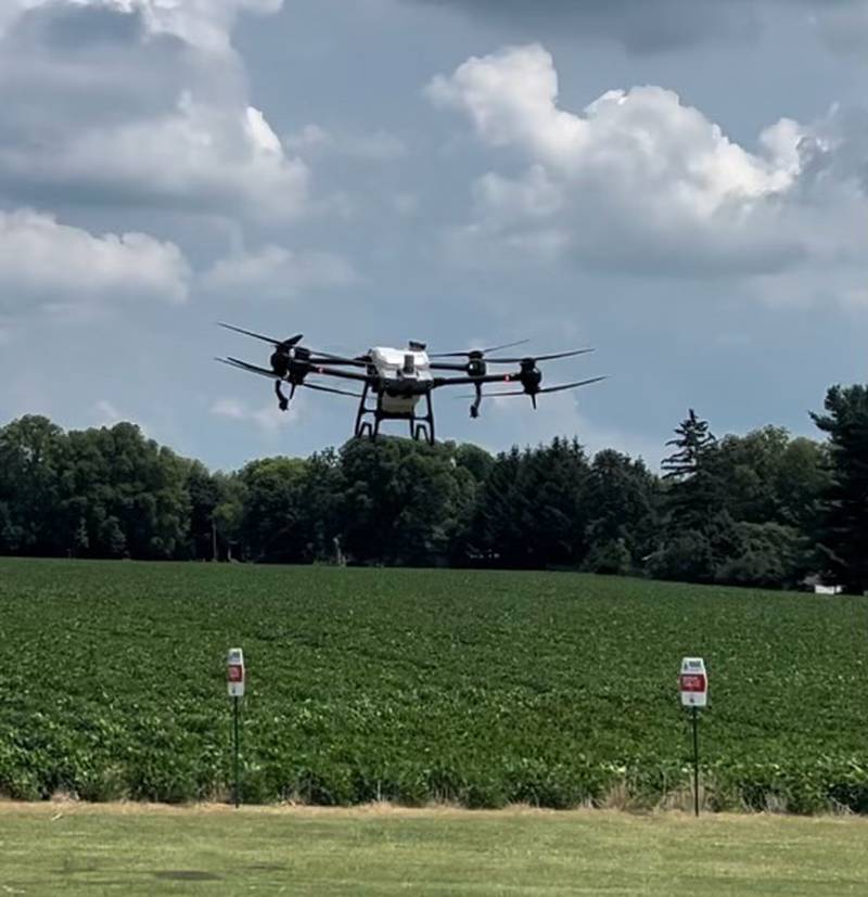 A drone applies fungicide to a soybean field.