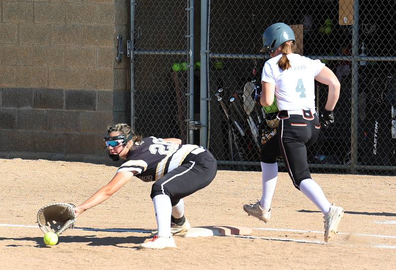 Sycamore's Kaitlyn Williams tries to pick the ball out of the dirt as Freeport's Cameren Plowman beats out the throw during their Class 3A regional championship game Friday, May 26, 2023, at Sycamore High School.