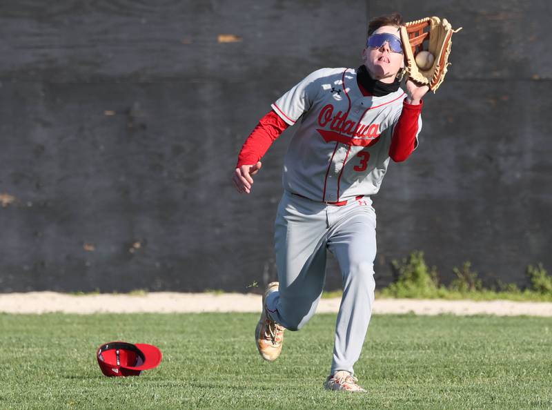 Ottawa's Jaxon Cooper makes a running catch during their game against Sycamore Friday, April 19, 2024, at the Sycamore Community Sports Complex.