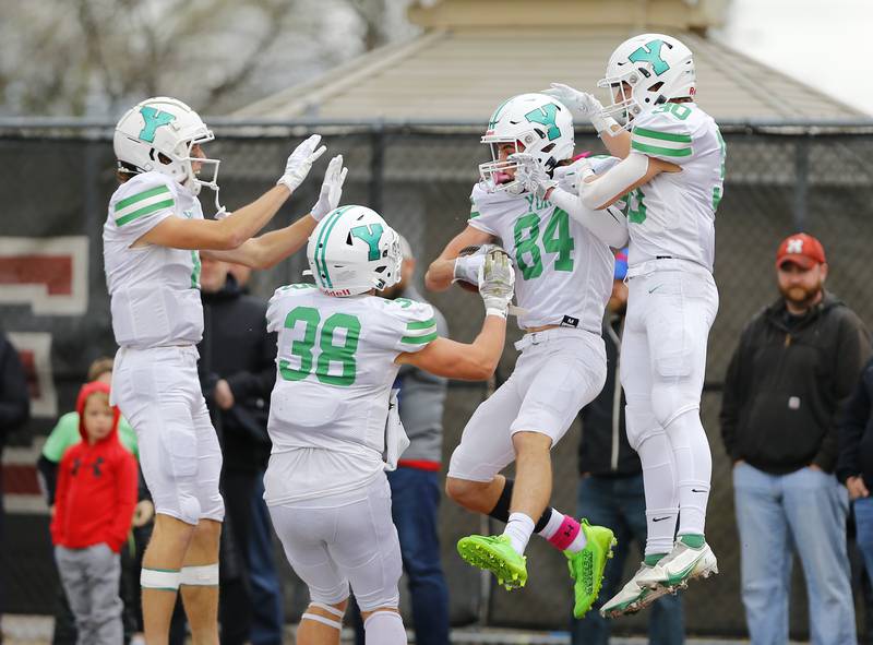 York's offense celebrates a touchdown by Luke Mailander (84) during a second round Class 8A varsity football playoff game between York High School and Marist High School on Saturday, Nov. 5, 2022 in Chicago, IL.