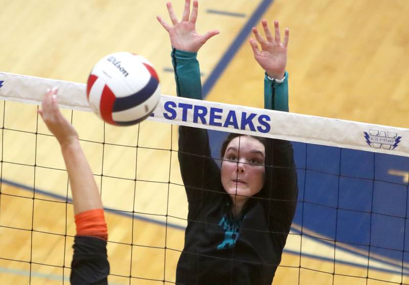 Woodstock North’s Avari Howard blocks against Crystal Lake Central in IHSA girls volleyball Class 3A Regional action at Woodstock High School in Woodstock on Thursday, October 30, 2025.