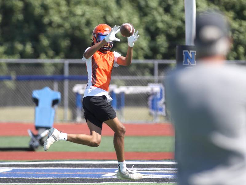 Wheaton Warrenville South’s Braylen Meredith makes a catch during a 7 on 7 tournament at St. Charles North High School on Thursday, June 30, 2022.