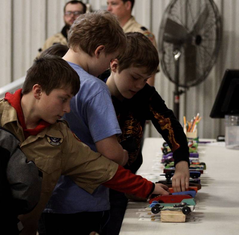 Webelos prep their pinewood derby cars on Saturday, Feb. 11, 2023 during the Cub Scout Pack 85 Derby at Bethel Evangelical Congregational Church in Dixon.