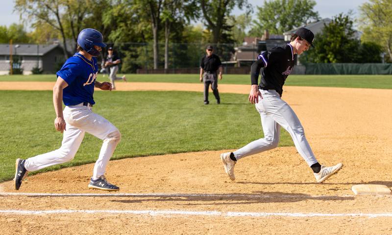 Downer’s Grove North pitcher Colin Doyle tags first for an out during a game against Lyons Township in Downers Grove on Monday, May 12, 2025.