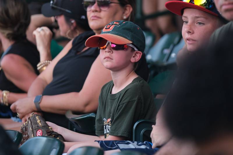 Bash Anderson, 7, of Minooka, watches the game as the Joliet Slammers take on the Ottawa Titans at the home opener. Friday, May 13, 2022, in Joliet.