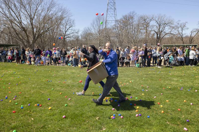 Dixon Park District director Duane Long and Michele Kreczmer fire off some more eggs at the start of the 0-4 age egg hunt Saturday, April 8, 2023.