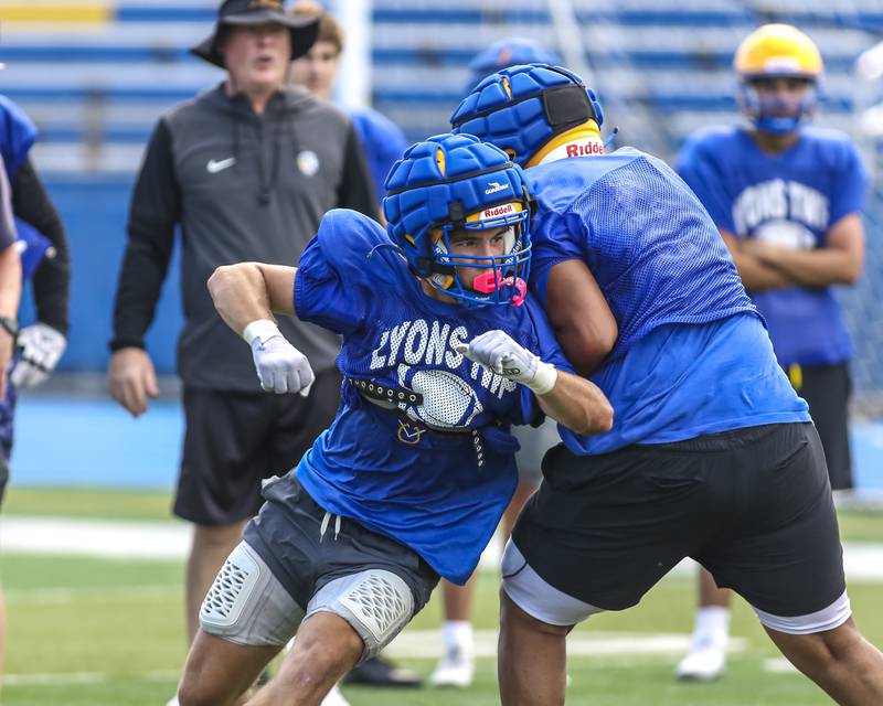 Lou Ratcliffe sheds a block at Lyons football practice, Monday, Aug 18, 2025  in Western Springs.