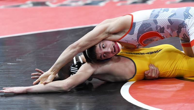 Oregon's Isaiah Perez reaches for the arm of Lena-Winslow's Brandon White in the 126-pound championship match at the 1A Stillman Valley Sectional on Saturday, Jan. 31, 2026 at Stillman Valley High School.