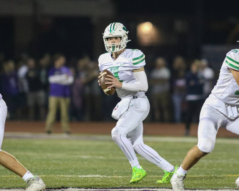 York's Sean Winton (4) looks for an open receiver during football game between York at Downers Grove North.  Sept 29, 2023.