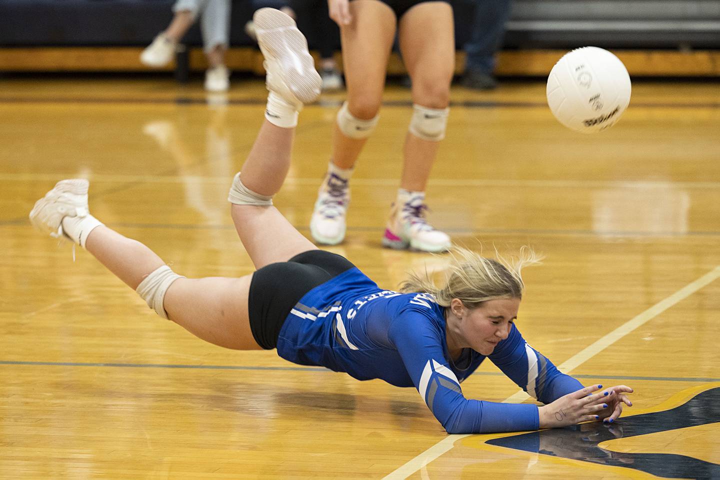 Newman’s Sam Ackman dives to save a shot in game two Wednesday, Oct. 26, 2022 in the semifinal volleyball match against Eastland.