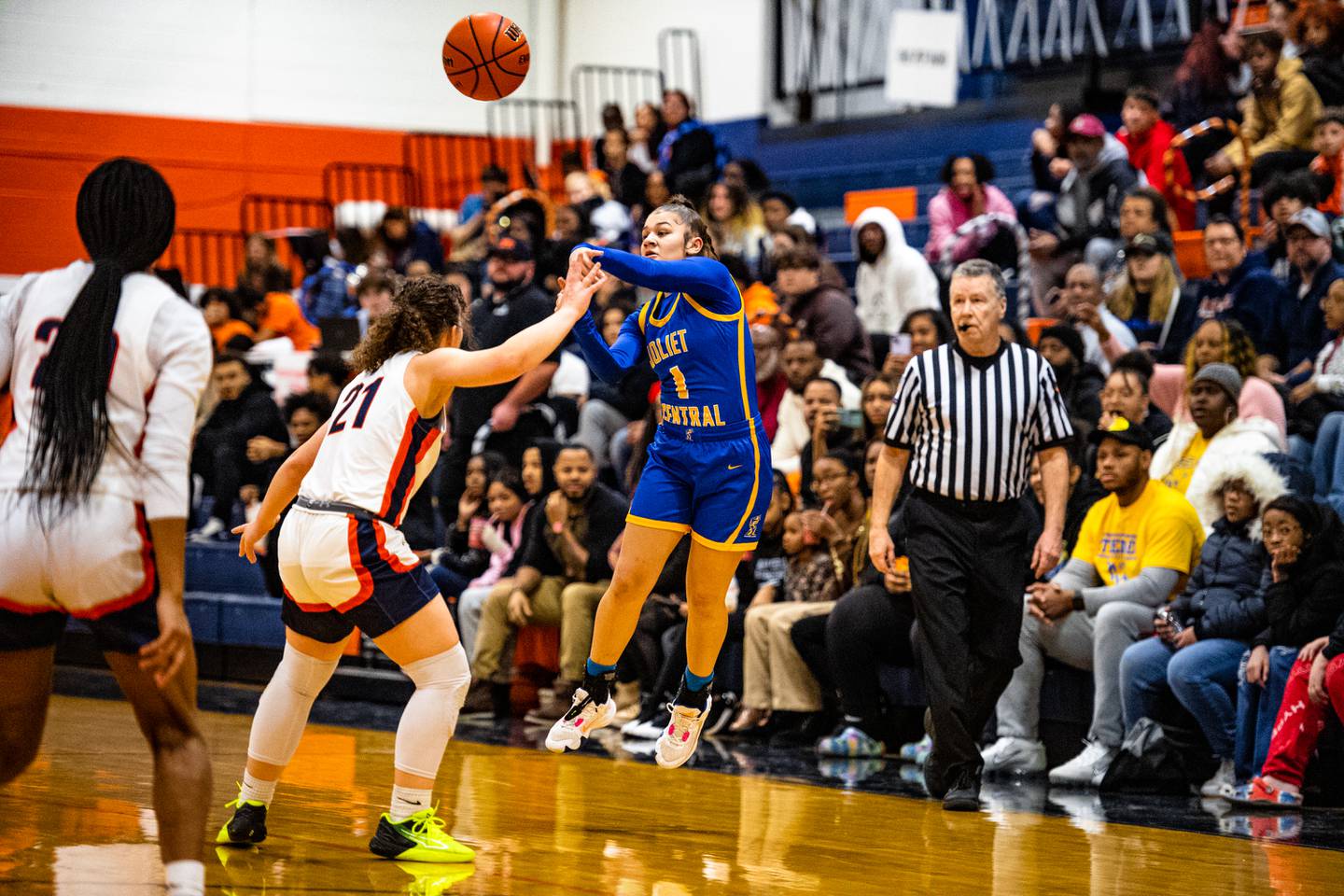 Joliet Central's Elliana Fowler passes the ball to a teammate during a game against Romeoville  Friday Feb. 3, 2023 at Romeoville  High School