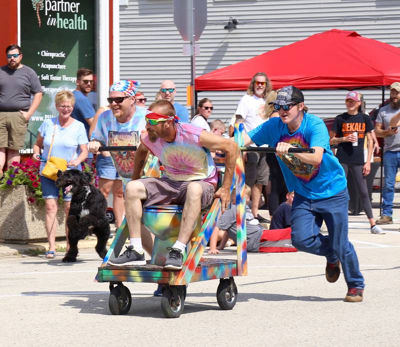 Team Hazy Dayz (l-r) Chad Ruff, Cory Richardson and Ayden Voigt participate in the Toilet Bowl Races at the Maple Park Fun Fest on Saturday, Sep. 3, 2022.
