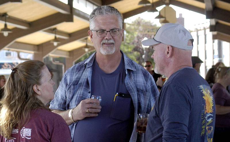 Sterling residents Amy and Rob Boze and Tim Pashon get together at Hops on the Rock on Saturday, Oct. 11. The Craft Beer Festival and Halloween Town offered fun for all in downtown Sterling.