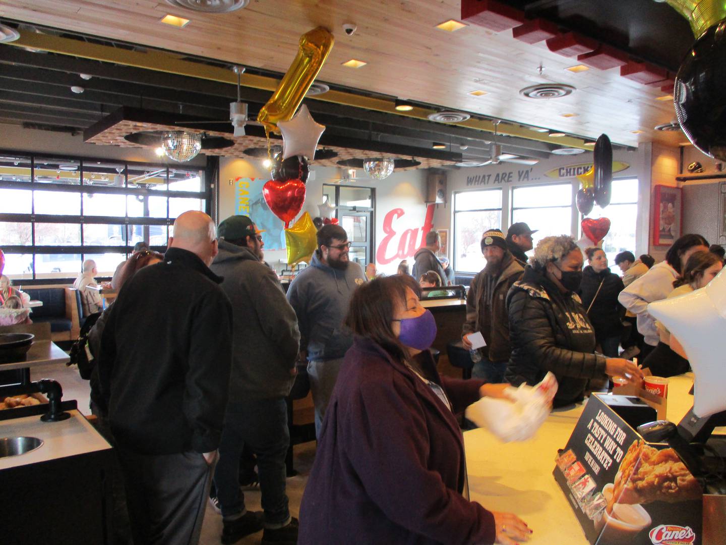 Customers place their orders at Raising Cane's Chicken Fingers, which opened Tuesday, March 8, 2022, at 3000 Plainfield Road in Joliet.